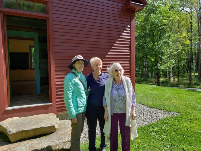 Barbara Fildes, Board member , leading a tour of the school house she owns, accompanied by Sarah Young and school teacher who taught in a one-room school.